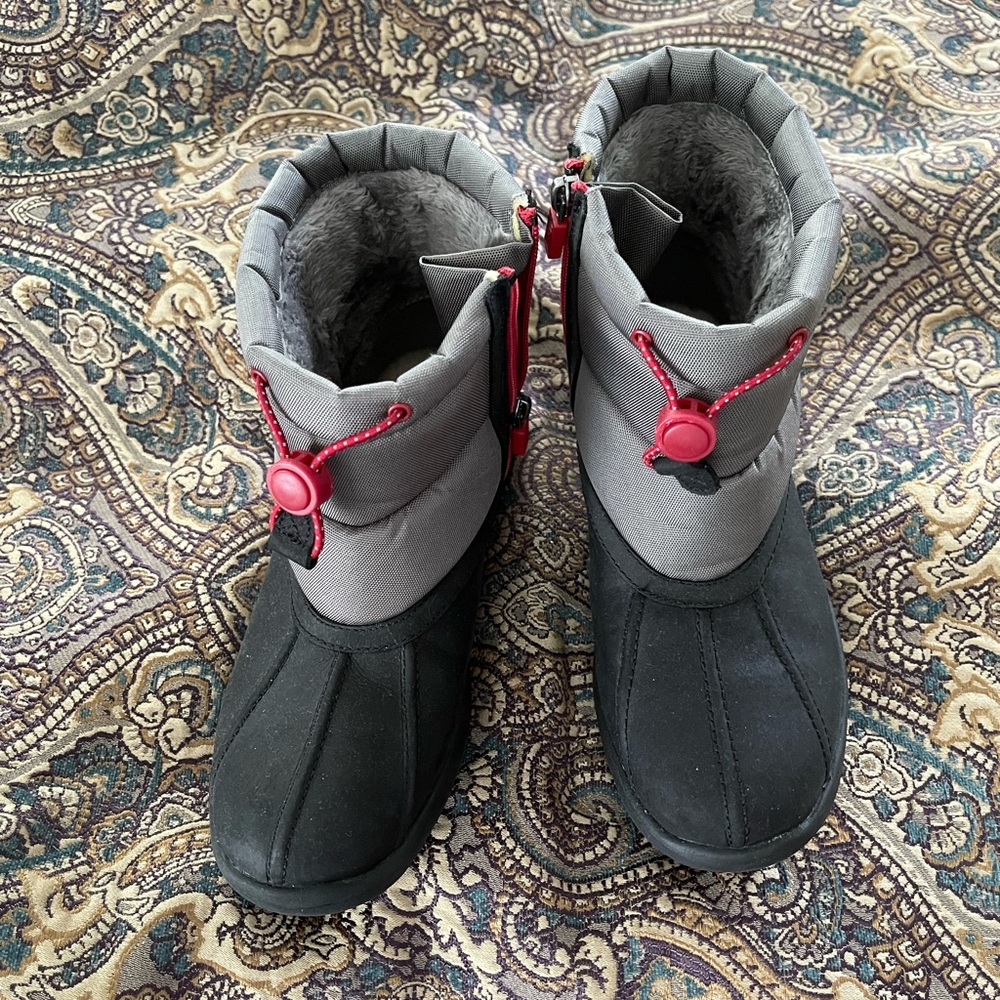 Brand new Ugg waterproof boot. Big Kids size 6. Black, grey with red accents.